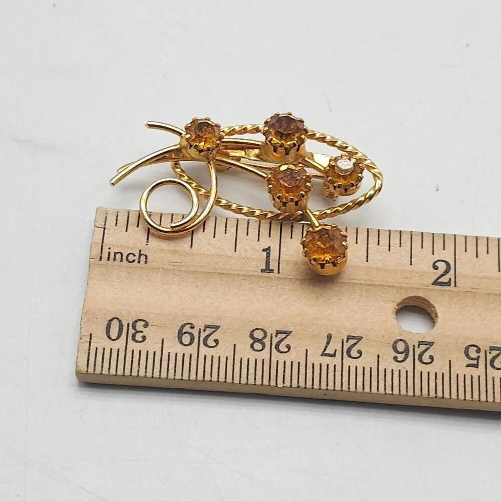 Vintage Gold Tone Floral Brooch With Amber Colored Rhinestones